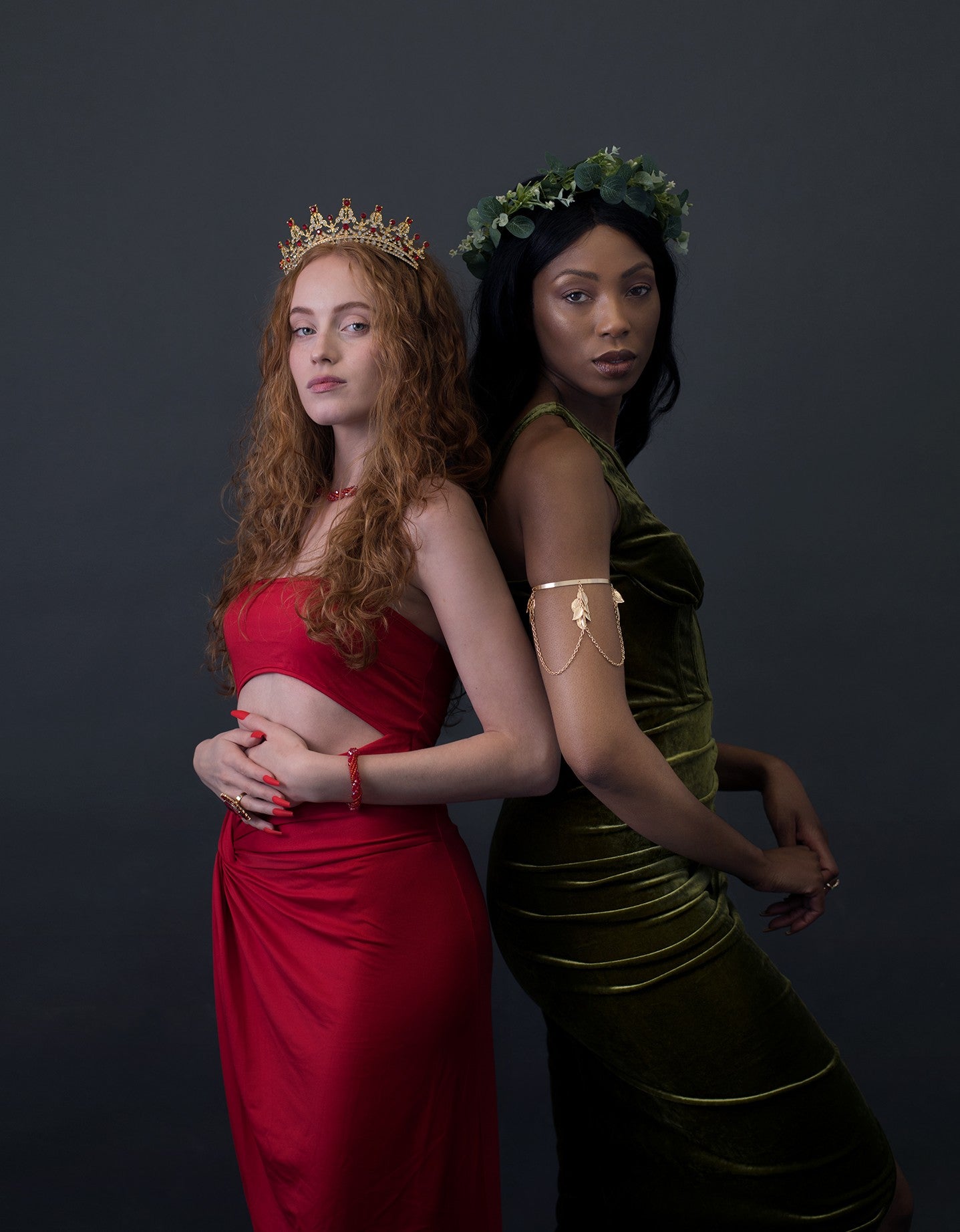 Naturally Wicked Fire Queen Dressed In Vibrant Red Back To Back With Naturally Wicked Earth Queen Dressed In Earthly Green