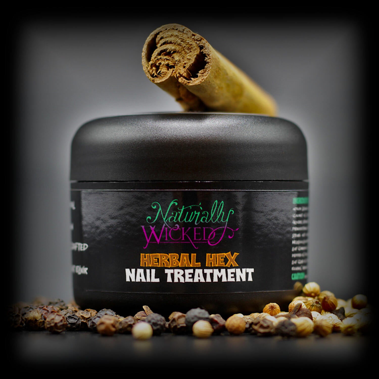 Naturally Wicked Herbal Hex Nail Treatment Surrounded By Nail Restoring Herbs; Cinnamon, Pepper, Clove & Coriander