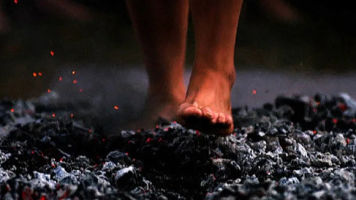 Walking bare foot on hot ashes and coal