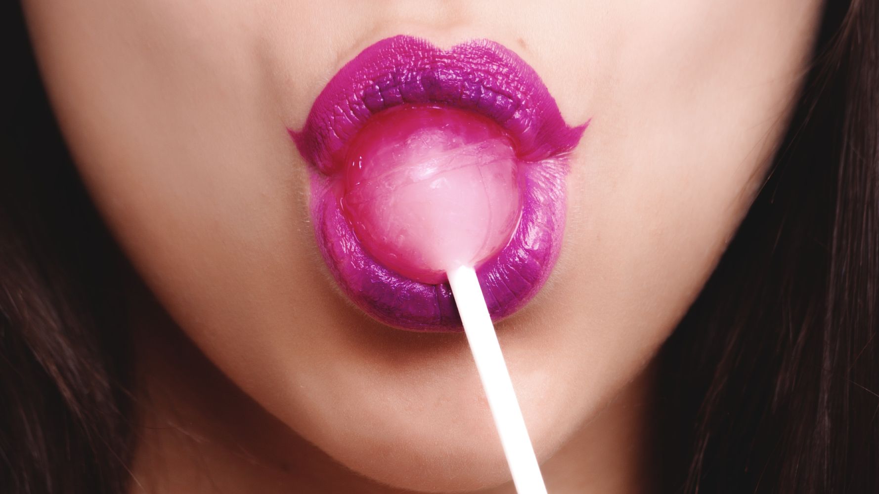 Lady With Pink Lips Sucking Pink Lolipop