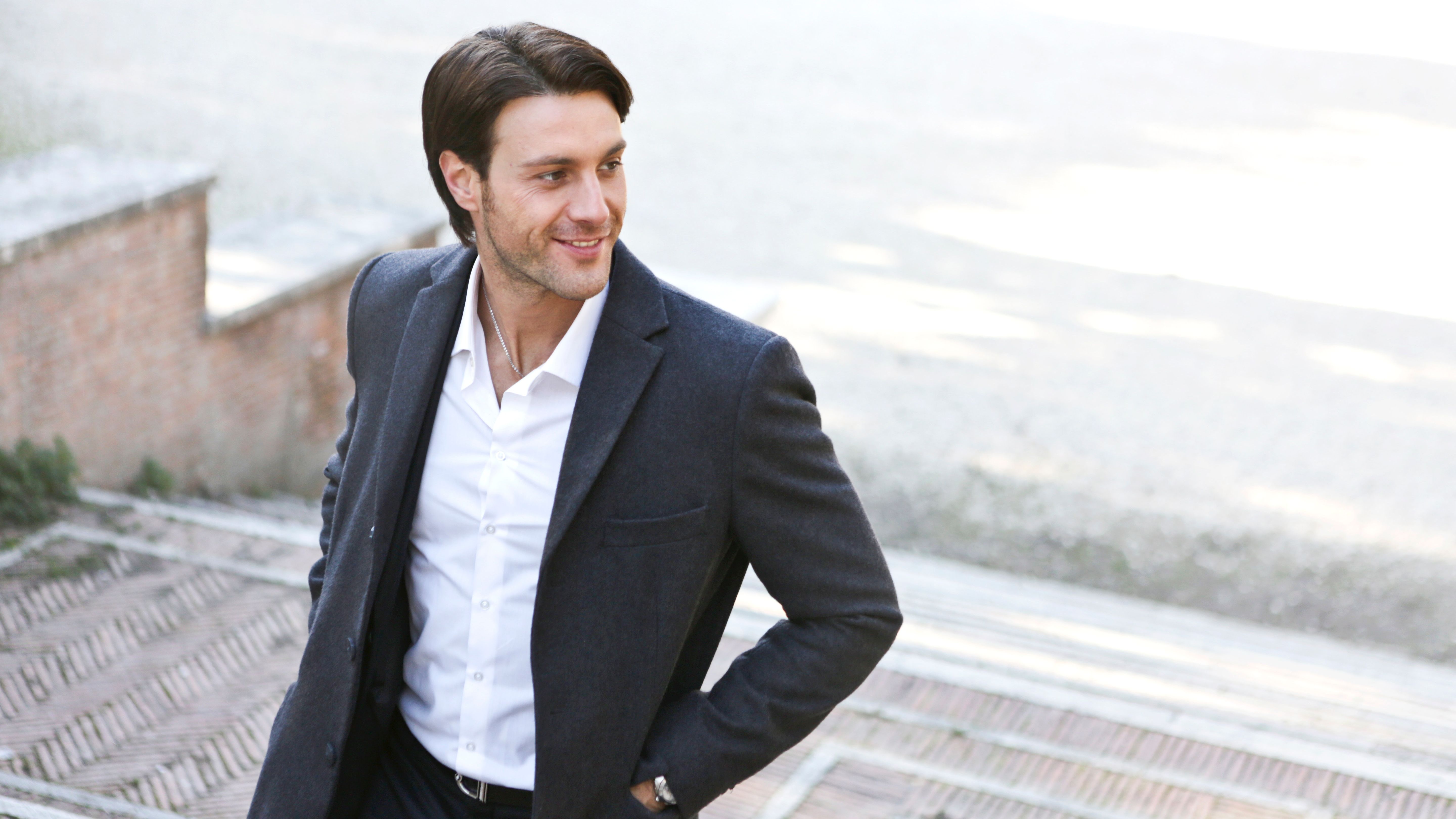 Gentleman with brown hair and smile