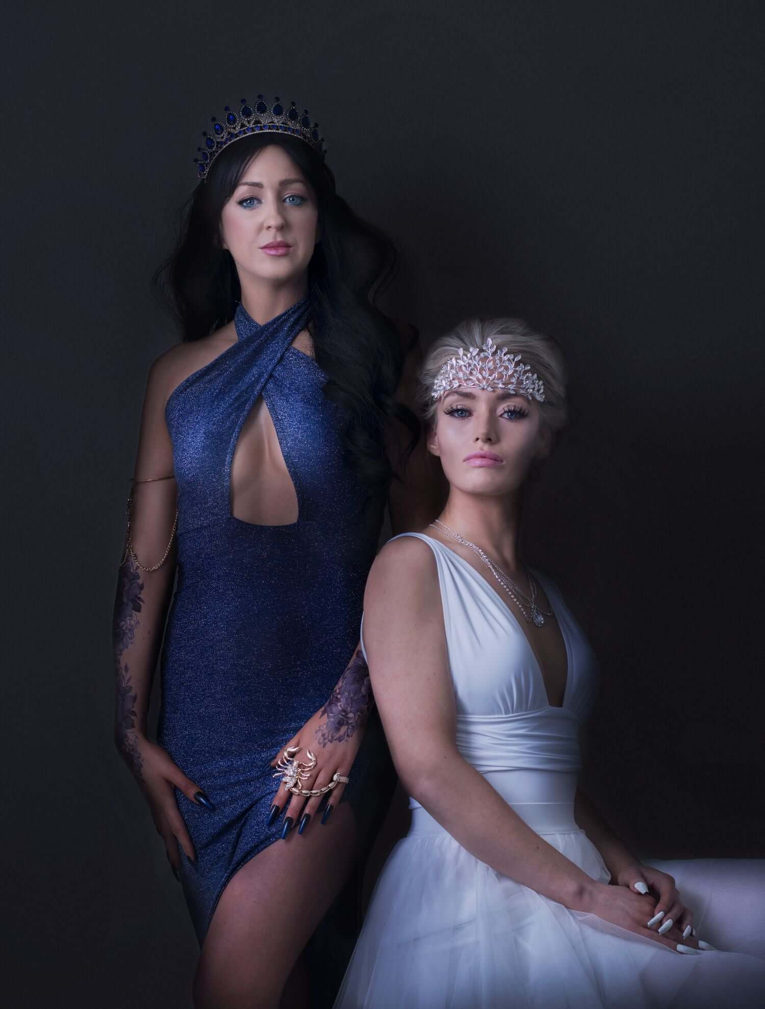 Naturally Wicked Water Queen Dressed In Blue Stands Beside The Sitting Naturally Wicked Ice Queen Dressed In White