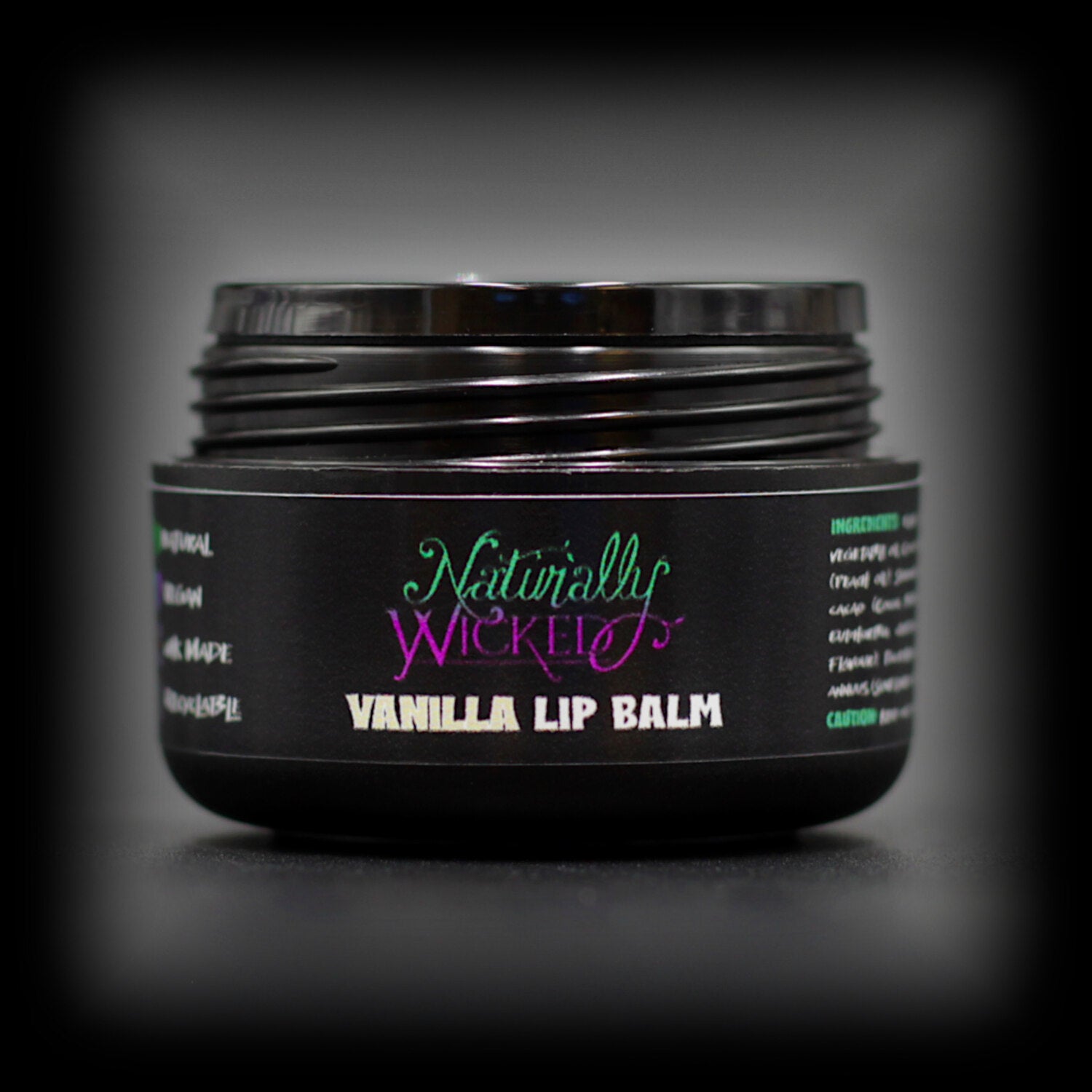 Naturally Wicked Vanilla Lip Conditioning Balm With Lid Removed Exposing Inner Lip Balm Seal