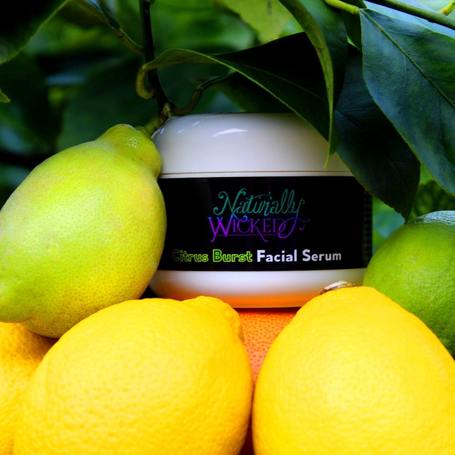 Naturally Wicked Citrus Burst Facial Serum Surrounded By Lemons & Limes Outdoors