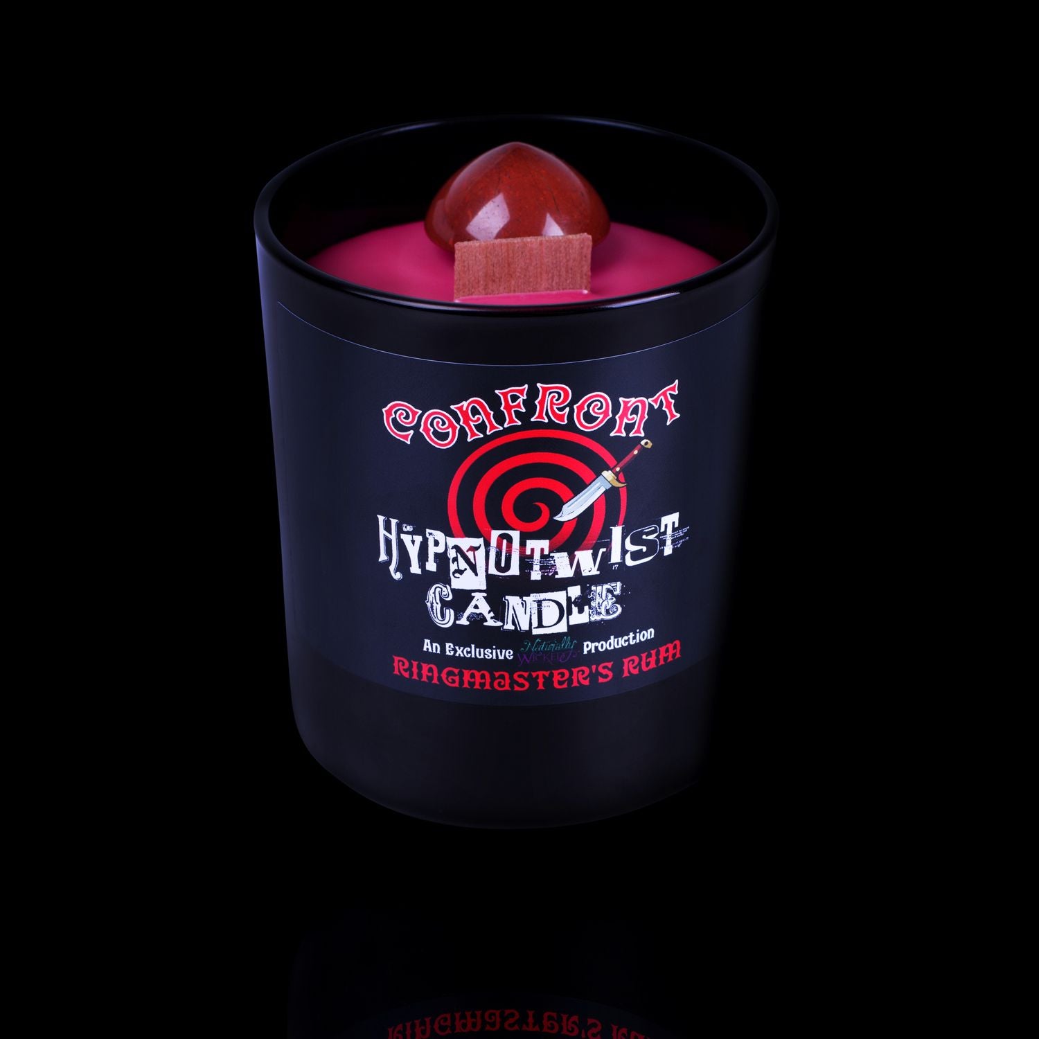Naturally Wicked Hypnotwist Confront Candle Featuring Plant-based Soy Red Wax Scented with Ringmaster's Rum & Includes A Red Jasper Crystal Spinning Top.