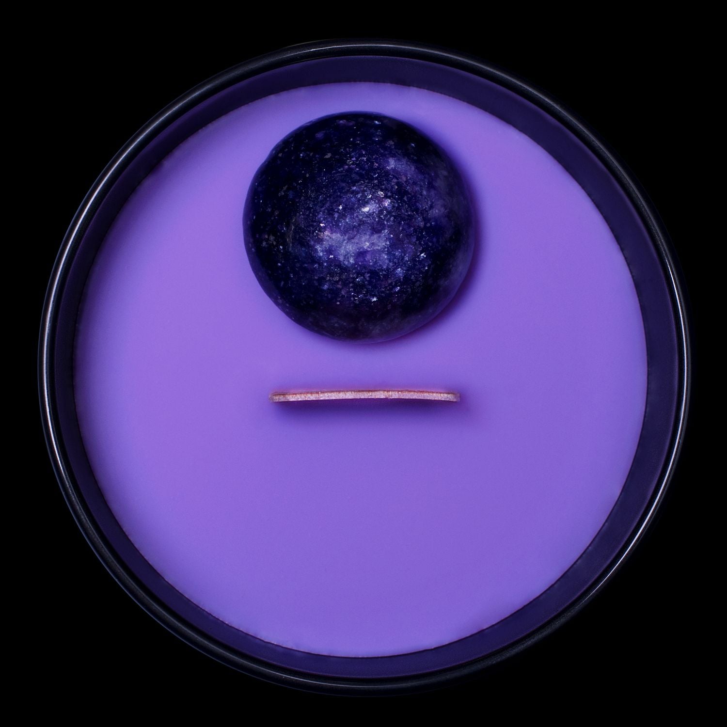 Birds Eye View Of The Naturally Wicked Hypnotwist Create Candle Featuring Plant-based Soy Purple Wax Scented With Performer Violet & Includes A Lepidolite Crystal Spinning Top & Wooden Wick