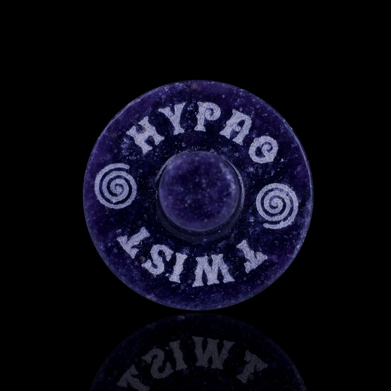 Front View Of The Naturally Wicked Exclusive Hypnotwister. A Lepidolite Crystal Spinning Top Engraved With Hypno Twist