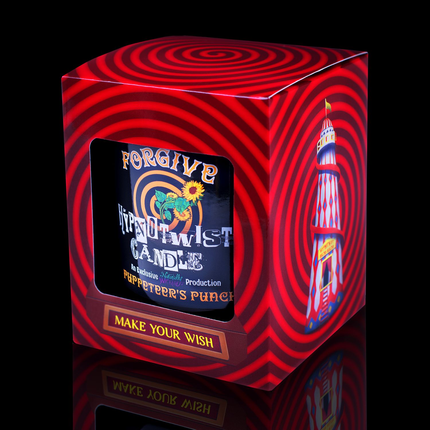 Side View Of The Naturally Wicked Hypnotwist Forgive Candle, Plant-based Soy Orange Wax Scented With Puppeteer's Punch, Including An Orange Aventurine Crystal Spinning Top, Mirrored Lid & Red Circus Hypnotic Gift Box
