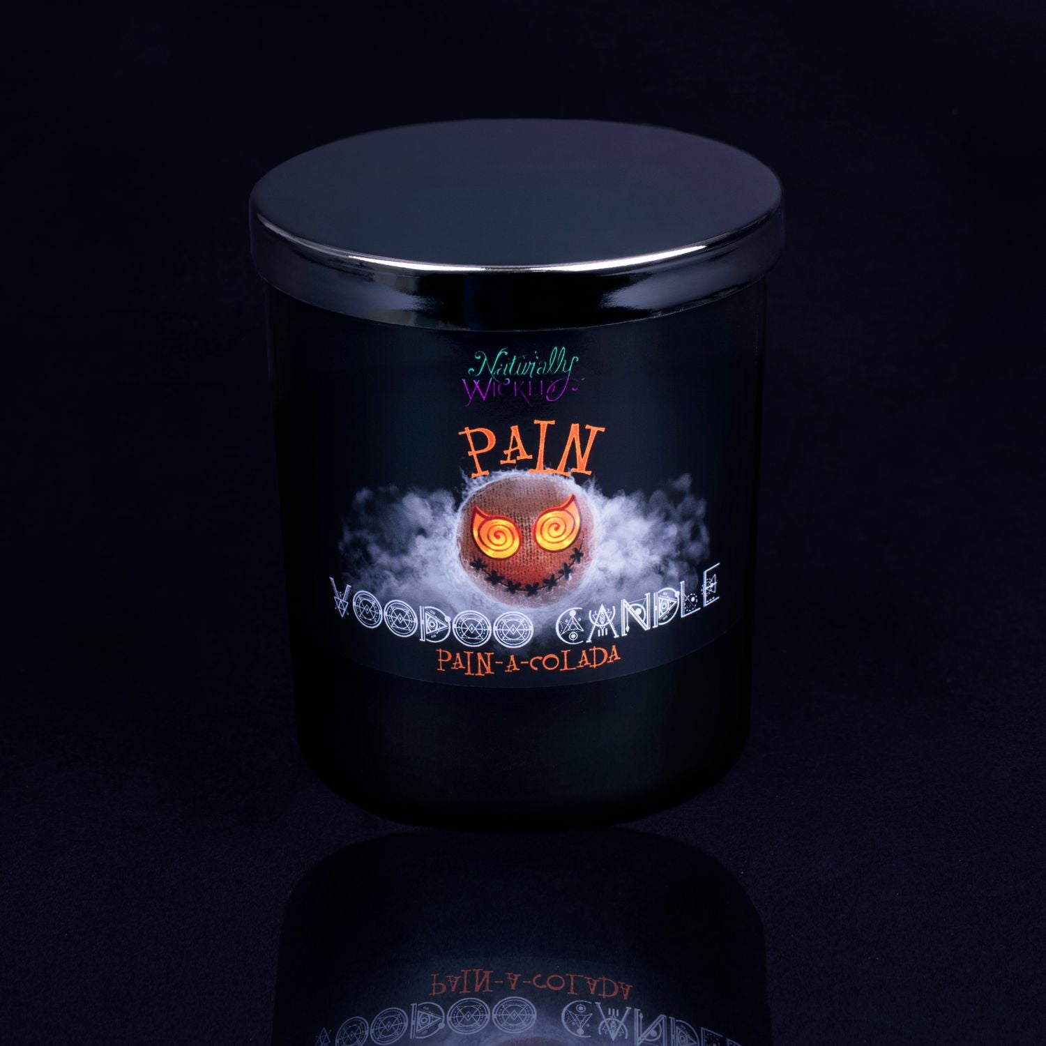 Naturally Wicked Voodoo Pain Spell Candle With Mirror Finished Exquisite Lid In Place. Featuring A Black Gloss Label, A Voodoo Doll Design And Pain-A-Colada Scent.