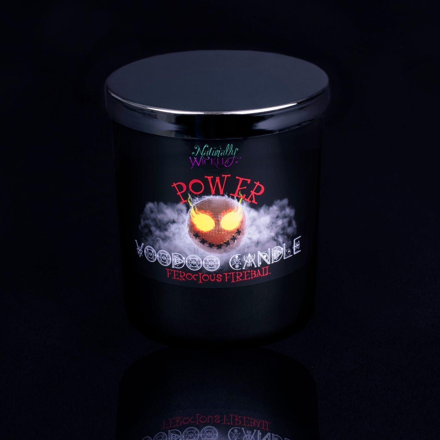 Naturally Wicked Voodoo Power Spell Candle With Mirror Finished Exquisite Lid In Place. Featuring A Black Gloss Label, A Voodoo Doll Design And Ferocious Fireball Scent.