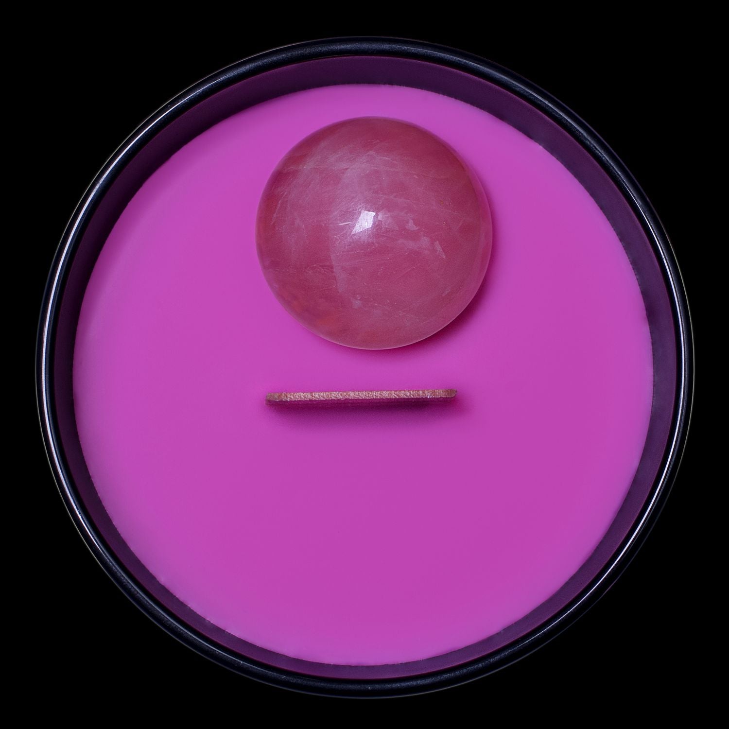 Birds Eye View Of The Naturally Wicked Hypnotwist Relax Candle Featuring Plant-based Soy Pink Wax Scented With Marsh-Mellow Magic & Includes A Rose Quartz Crystal Spinning Top & Wooden Wick