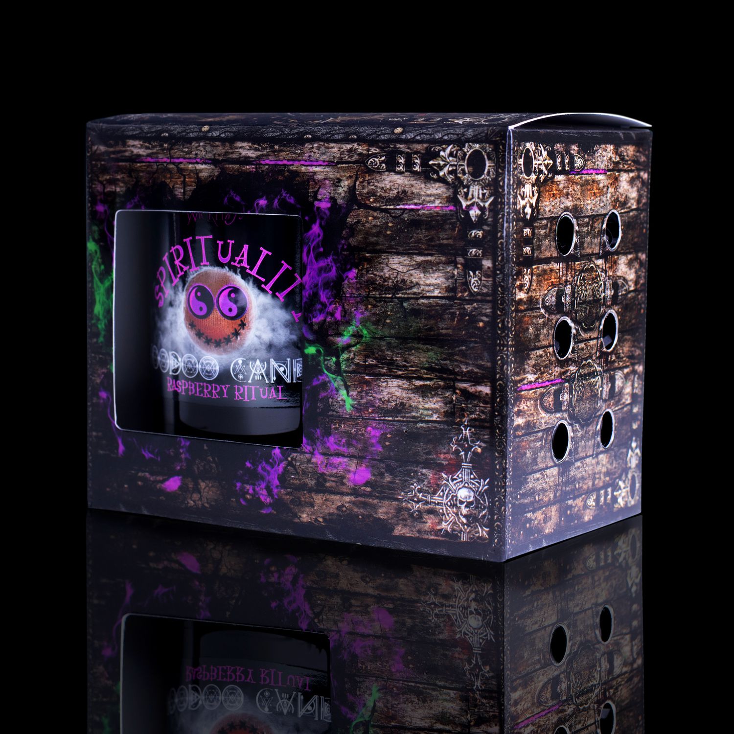  Side View Of The Fabulously Haunting Voodoo Spirituality Spell Candle. Naturally Wicked Voodoo Spirituality Candle Displayed In A Gift Box. The Candle Features Plant-Based Smooth Purple Wax, A Wood Wick, Purple Voodoo Doll And A Beautiful Purple Amethyst Crystal Wand.